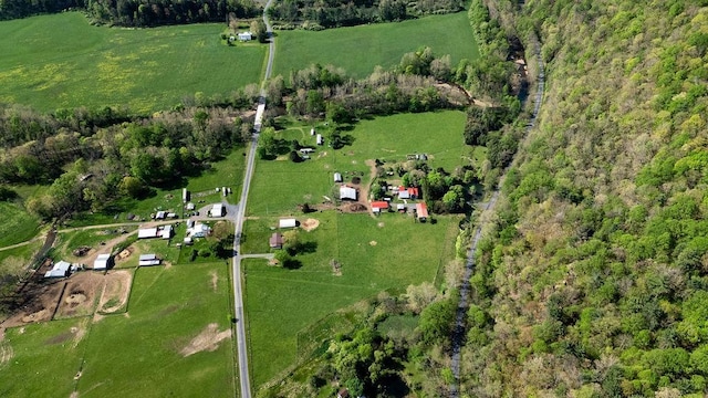 birds eye view of property with a rural view