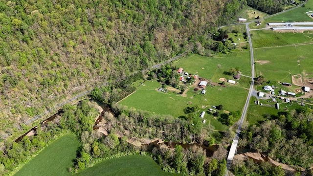 drone / aerial view with a forest view and a rural view