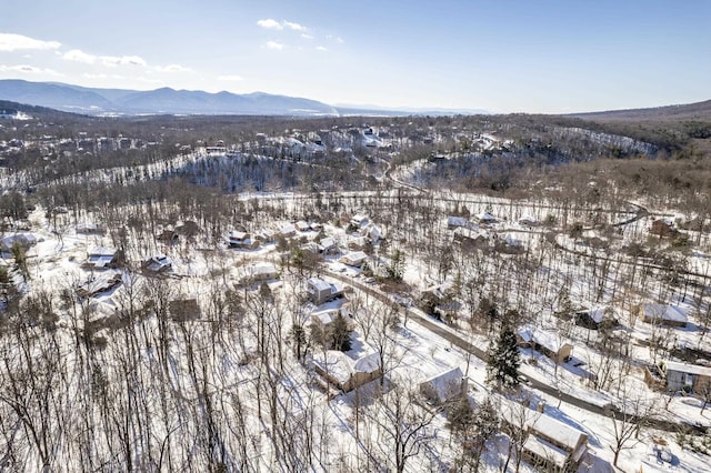 snowy aerial view with a mountain view