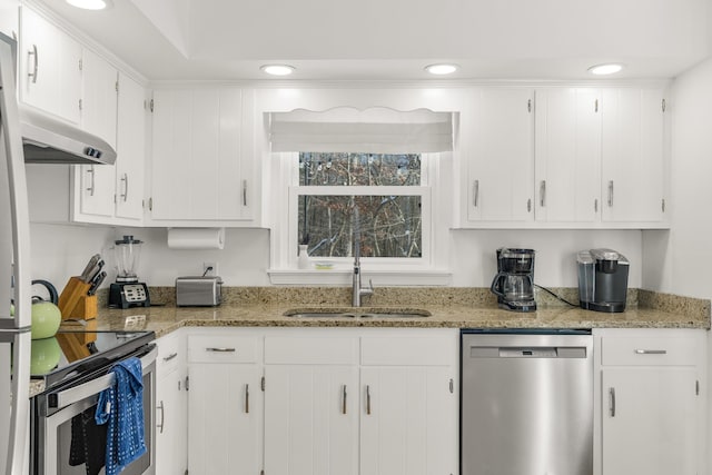 kitchen featuring white cabinetry, sink, stainless steel appliances, and stone countertops