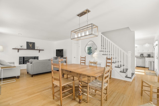 dining space with light wood-type flooring