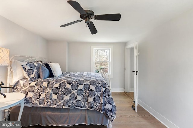 bedroom featuring ceiling fan and light hardwood / wood-style floors