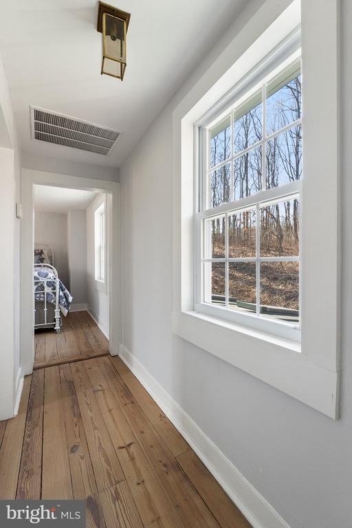 hall featuring wood-type flooring