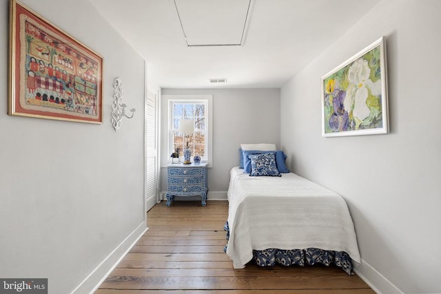 bedroom featuring hardwood / wood-style flooring