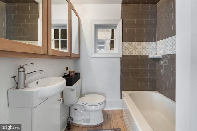 bathroom featuring hardwood / wood-style flooring, vanity, and toilet