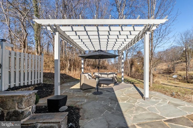 view of patio / terrace with an outdoor living space and a pergola