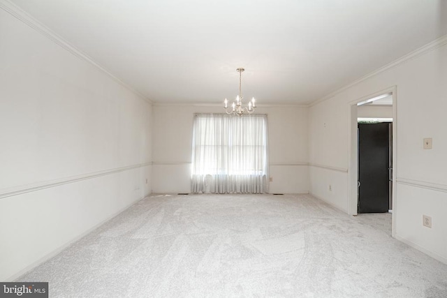 unfurnished room with carpet, crown molding, and a notable chandelier