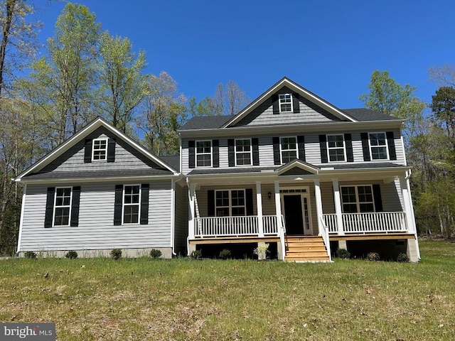 view of front of house with a front lawn and covered porch