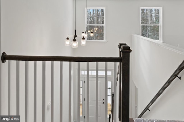 interior space with a healthy amount of sunlight and a notable chandelier