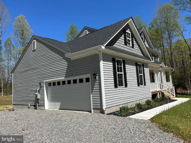 view of home's exterior featuring a garage, driveway, a porch, and a shingled roof