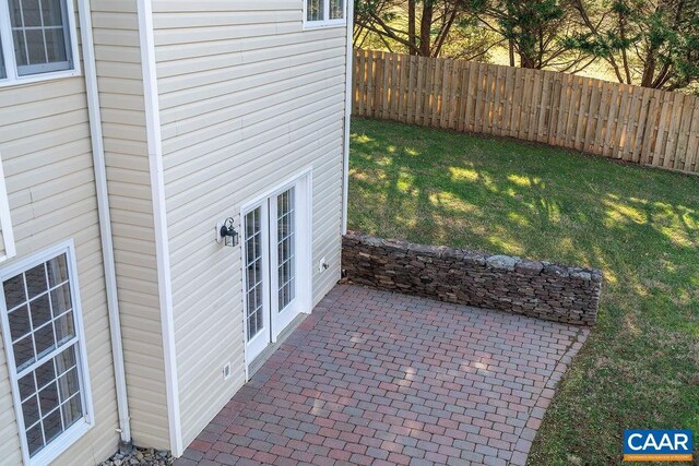 view of yard featuring fence and a patio