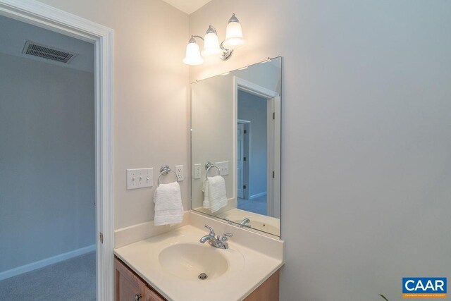 bathroom with vanity and visible vents