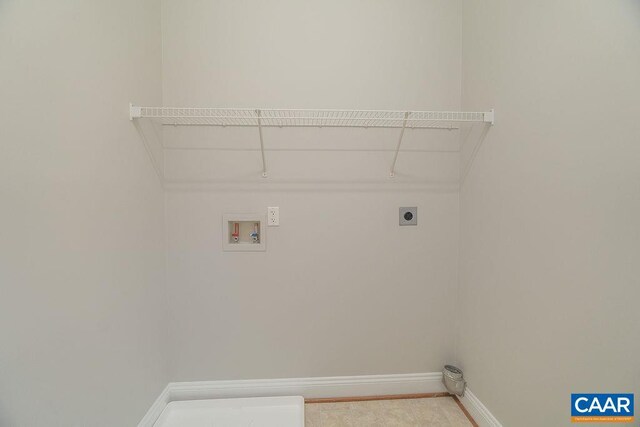 laundry area featuring baseboards, laundry area, hookup for a washing machine, and hookup for an electric dryer