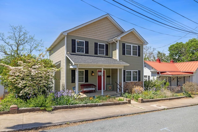 traditional-style house with covered porch