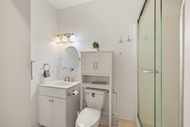 full bathroom featuring toilet, a shower stall, and vanity
