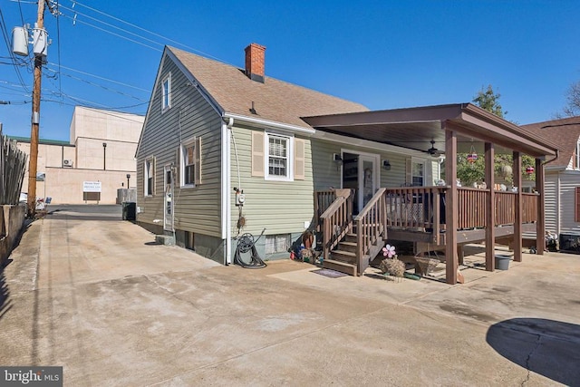 back of property with a patio and ceiling fan