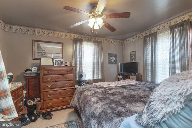 carpeted bedroom with ceiling fan