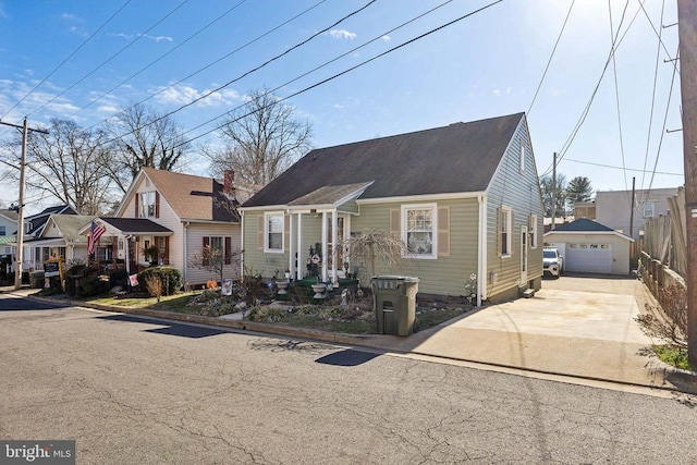 bungalow-style home featuring an outbuilding and a garage