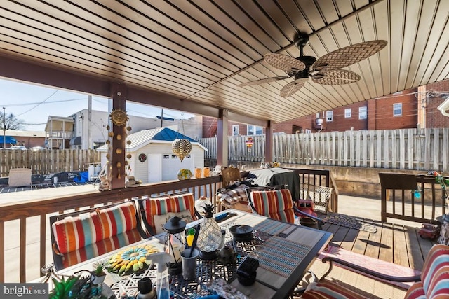 wooden deck featuring ceiling fan