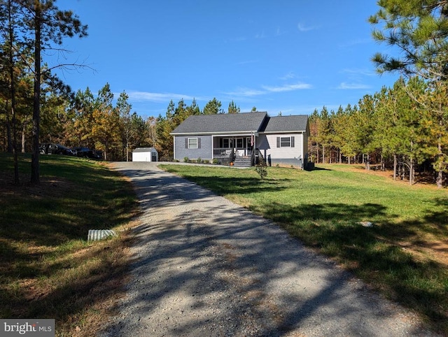 view of front of property with covered porch and a front lawn