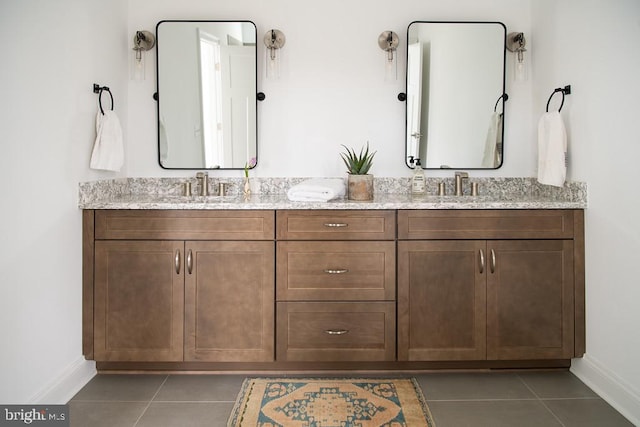 bathroom featuring tile patterned flooring and vanity