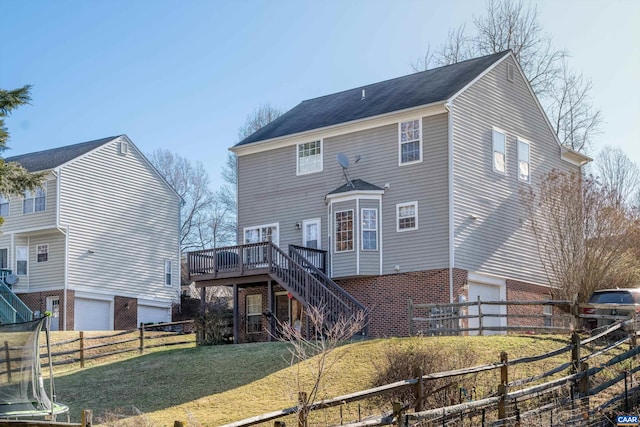 back of house with stairway, brick siding, a garage, and a lawn