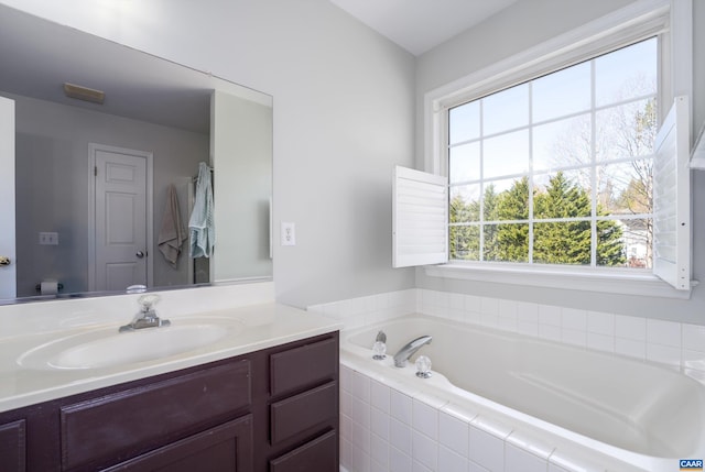 bathroom with a bath, toilet, and vanity