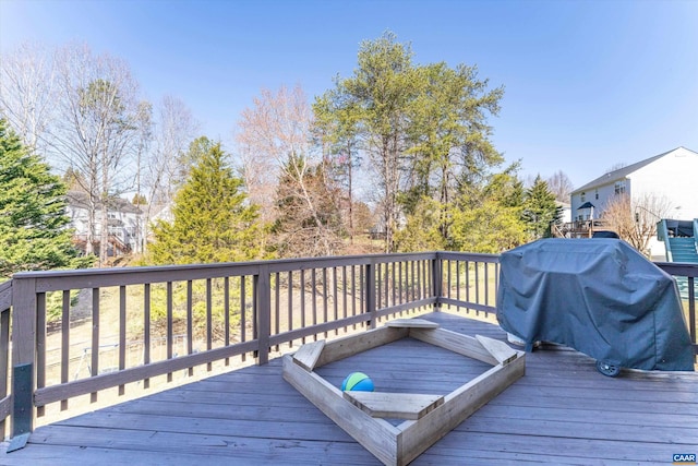 wooden deck featuring grilling area