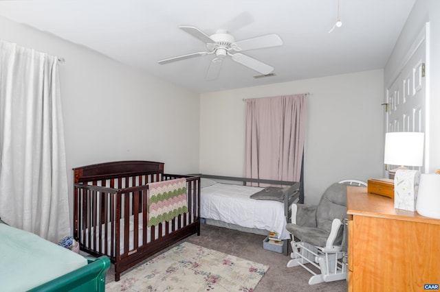 bedroom with a ceiling fan, visible vents, and carpet floors