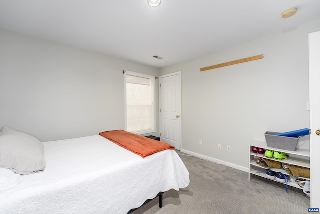 bedroom featuring visible vents, baseboards, and carpet floors