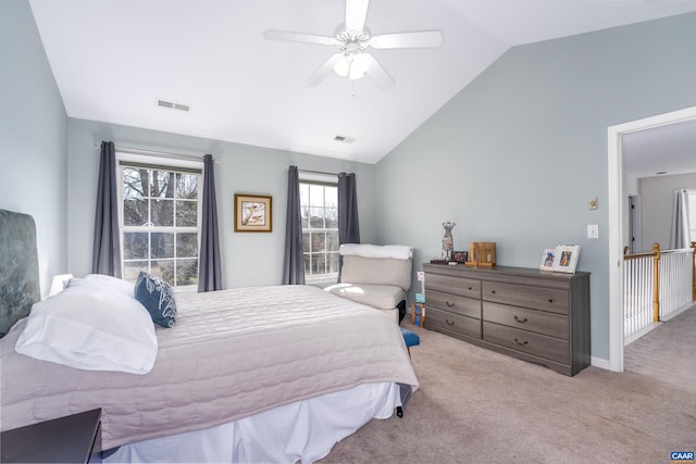 bedroom featuring lofted ceiling, carpet flooring, visible vents, and ceiling fan