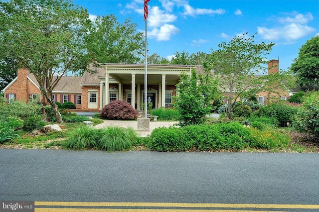 neoclassical home with brick siding