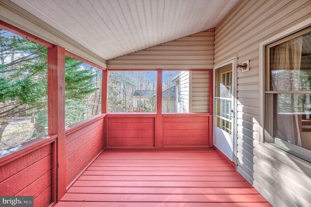 unfurnished sunroom featuring wooden ceiling and vaulted ceiling