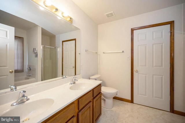 bathroom with a stall shower, visible vents, a sink, and double vanity