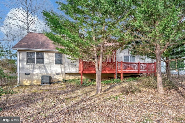 back of house featuring cooling unit, crawl space, and a deck