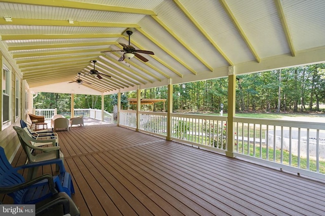 wooden terrace featuring ceiling fan