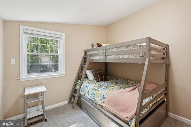 carpeted bedroom featuring baseboards