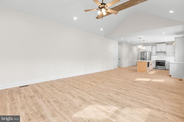 unfurnished living room with high vaulted ceiling, recessed lighting, ceiling fan with notable chandelier, baseboards, and light wood-type flooring