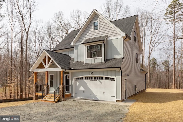 view of front of property featuring board and batten siding, a shingled roof, driveway, and a garage