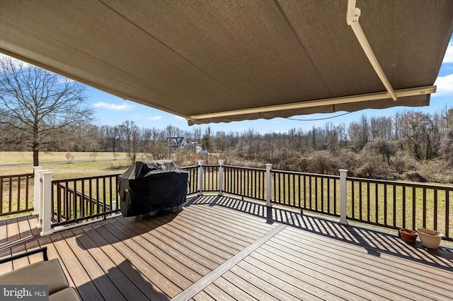 deck with a lawn and a grill