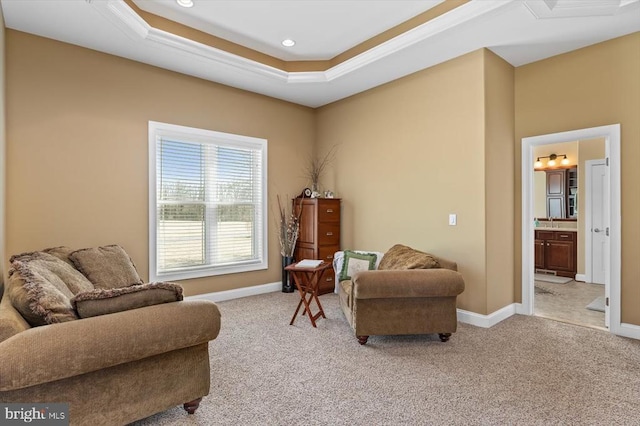 living area with light carpet, baseboards, a tray ceiling, and recessed lighting