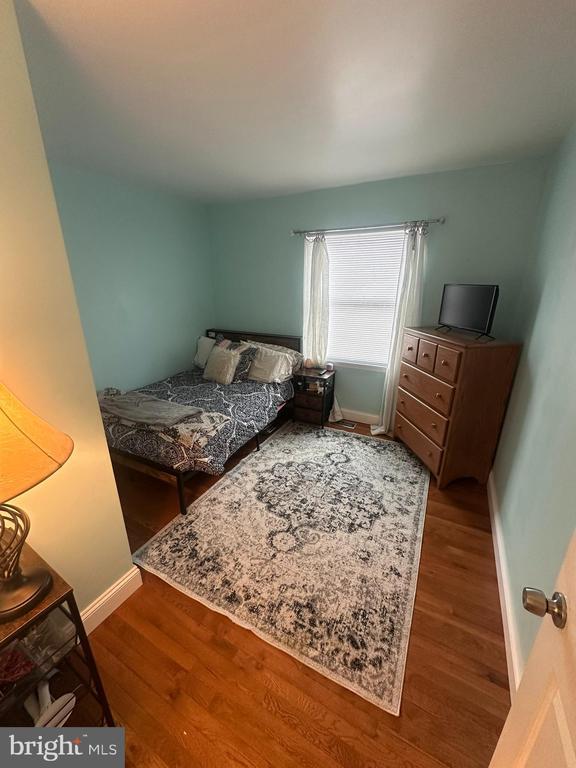 bedroom with wood-type flooring