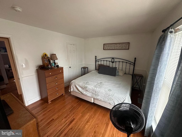 bedroom featuring hardwood / wood-style flooring and a closet