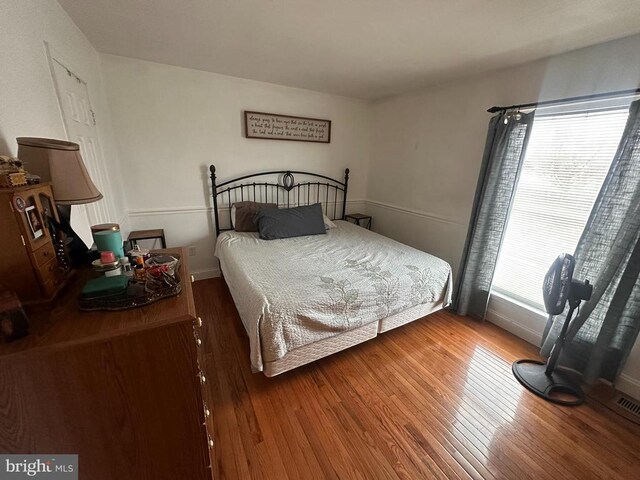 bedroom featuring hardwood / wood-style floors