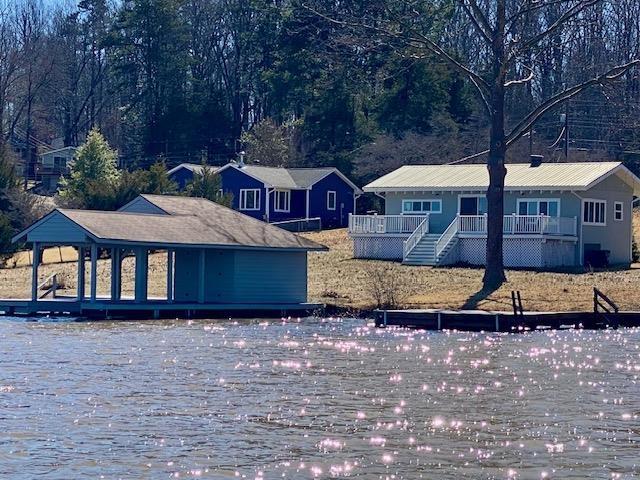 exterior space with a deck with water view