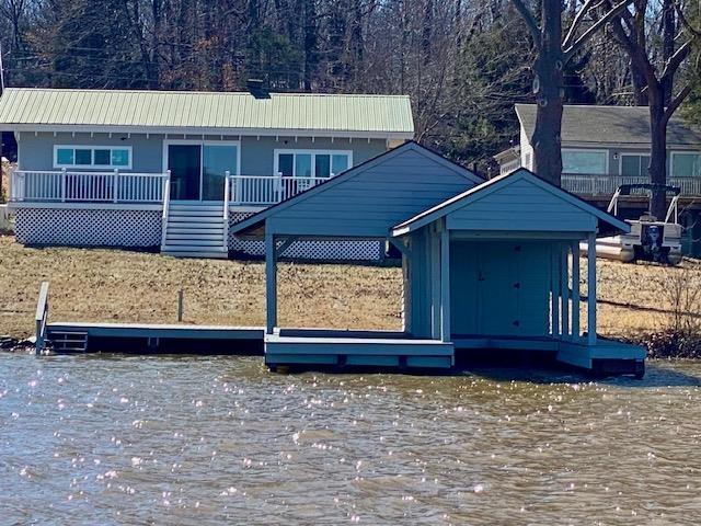 view of front of house with a dock