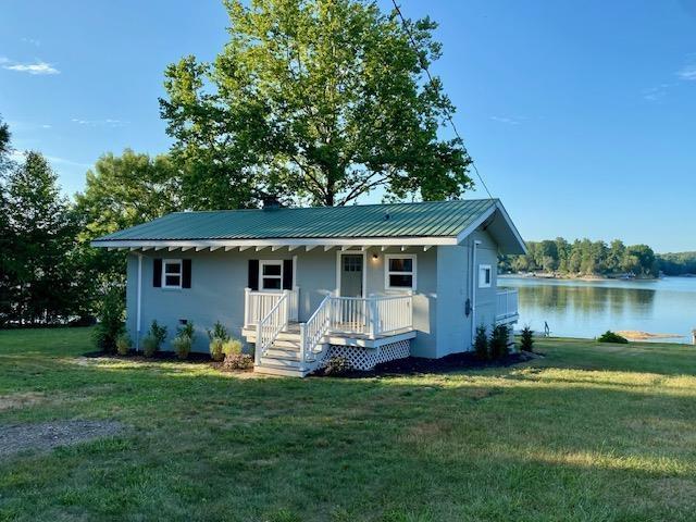 view of front of house featuring a water view and a front yard