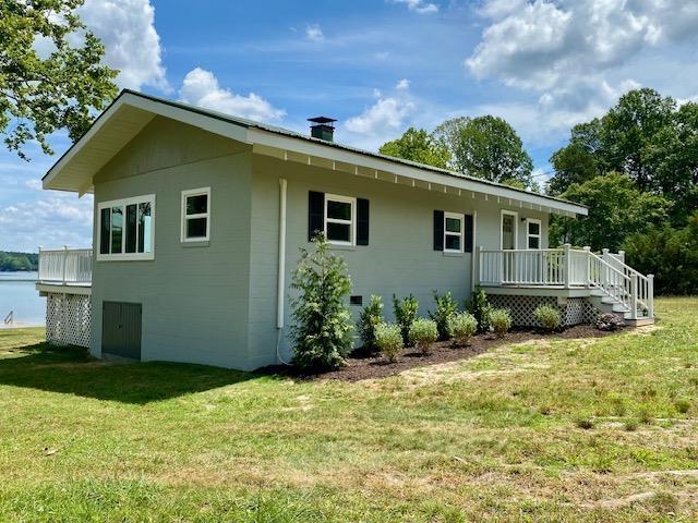 exterior space with a yard and a deck