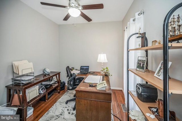 office area featuring a ceiling fan and wood finished floors