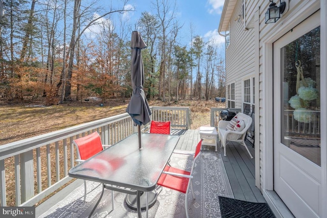 wooden deck with outdoor dining space